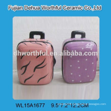 Lovely ceramic saving money bank in suitcase shape